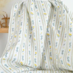Voile plumetis rayures et citrons fond écru